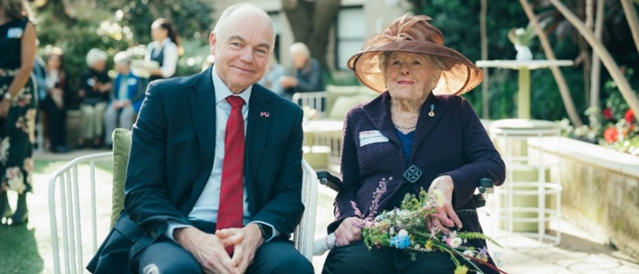 Banksia Association VC Andrew Deeks sitting with a Banksia Association member