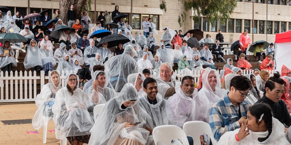 Guests in ponchos due to wet weather