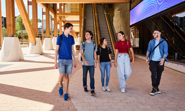 BK exterior, five students walking