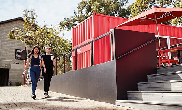 2 students walking to MyAdvice location