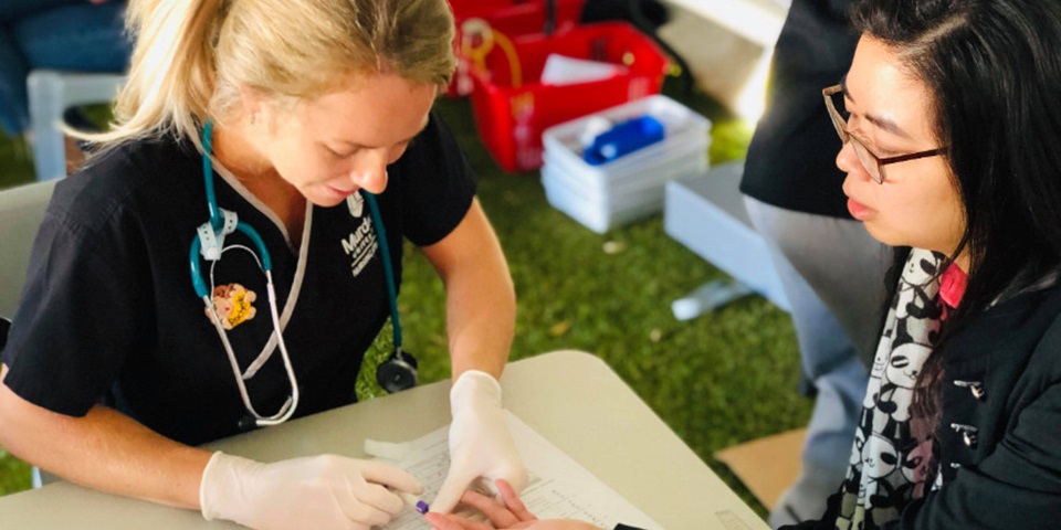 A nursing student performs a test