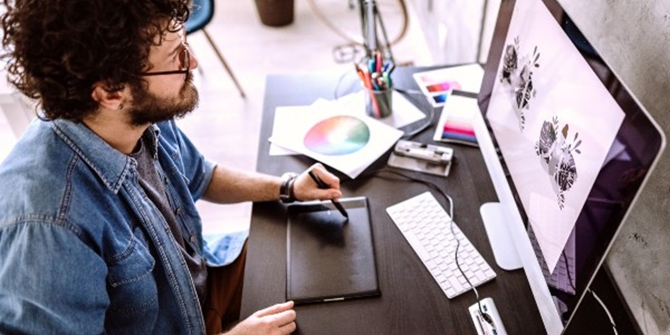 Animator creating animation on computer