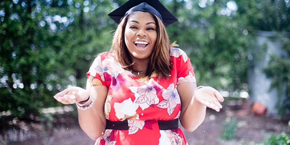 Mature age woman wearing graduation hat