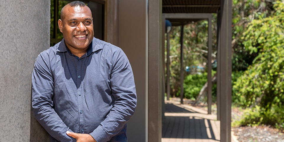 Benson Hahambu Feature PNG student Benson Hahambu smiling outside