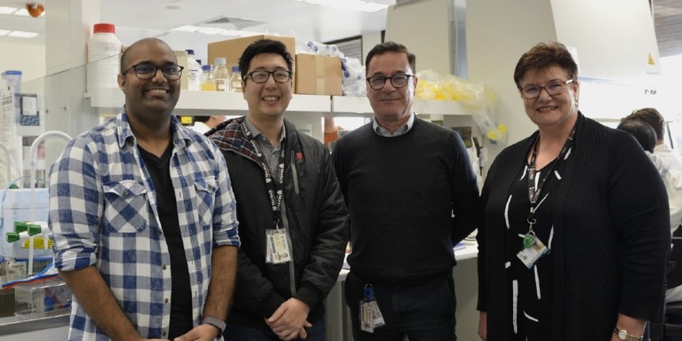 Team of investigators leading the clinical trail in a laboratory