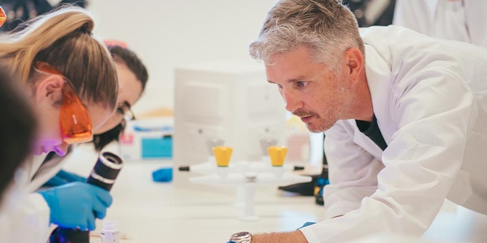 Senior Lecturer Brendan Chapman with his students in the lab