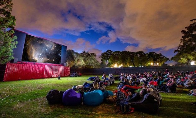 Guests on beanbags enjoy an evening movie at Murdoch's outdoor cinema