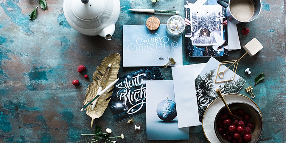Coping during the holidays feature Overlay of Christmas arts and crafts spread over a table