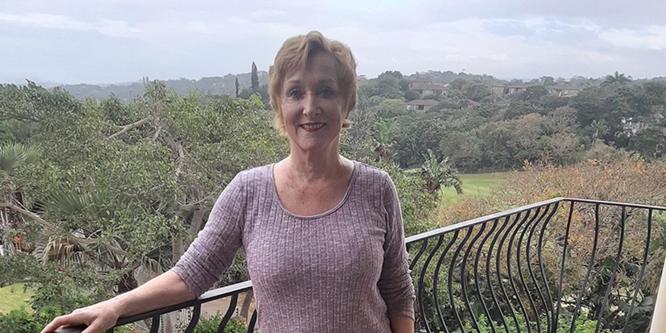 Cynthia Hulme feature Cynthia stands on her balcony overlooking the South African jungle