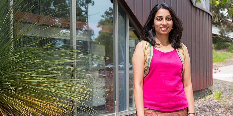 Deepa Machaiah feature Student Deepa Machaiah posing and smiling outside building and grass tree at Murdoch