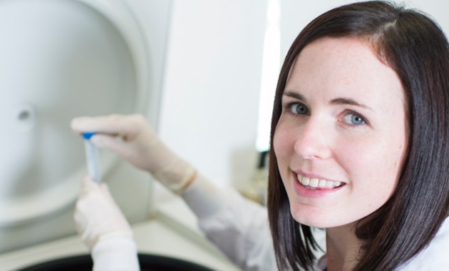 Dr Belinda Brown working in a lab