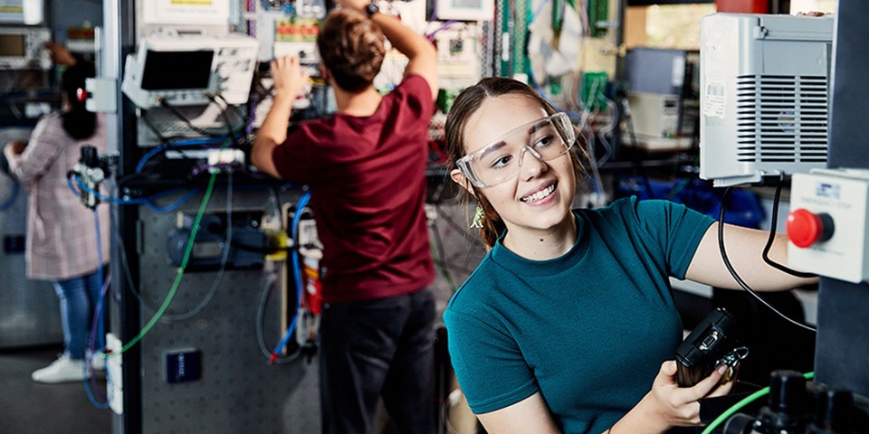 Engineering_Study_Feature Female student works in engineering lab.