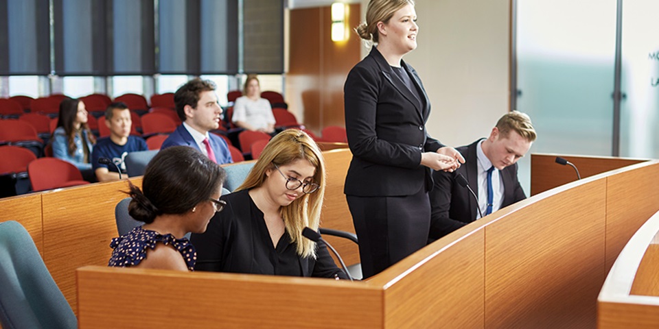 Female law student in mock court