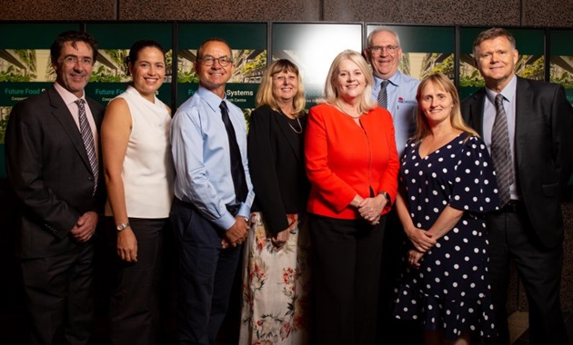 Professor Elaine Holmes with researchers and the minister