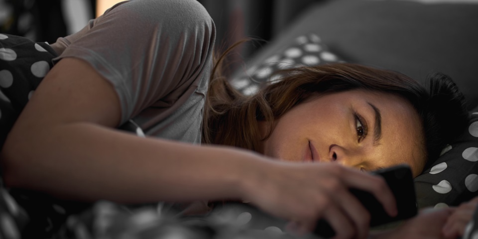 Girl on Mobile Phone Girl on mobile phone in bed