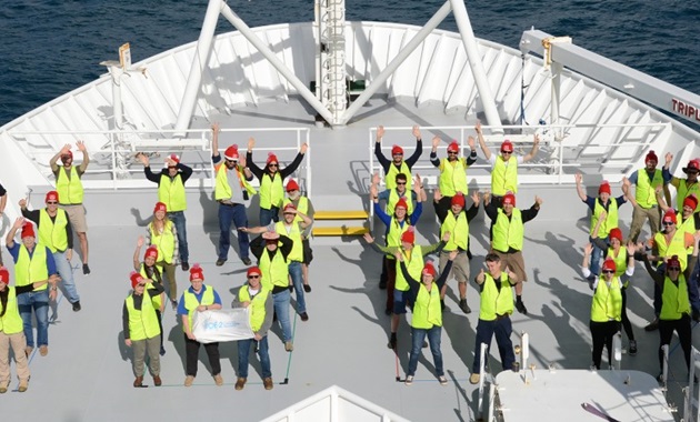 Aerial view of RV investigator crew waving