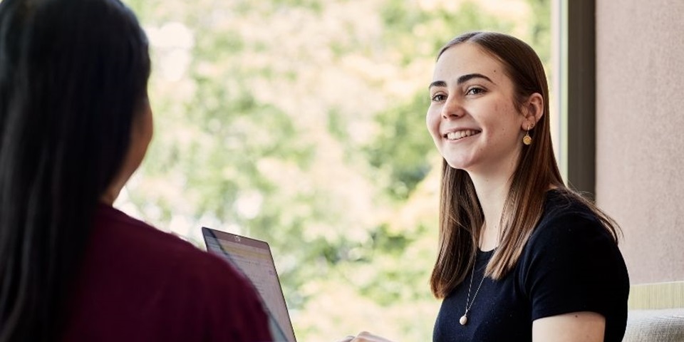 Influencer HS Subjects 860x480 Students having a conversation in front of a laptop