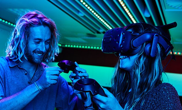 Male and female students using virtual reality headset.