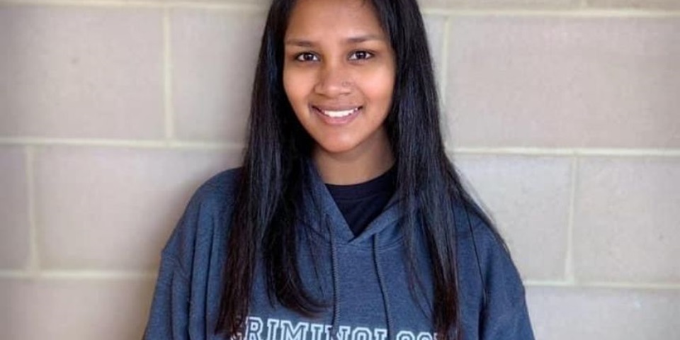 Student smiles in Murdoch hoody