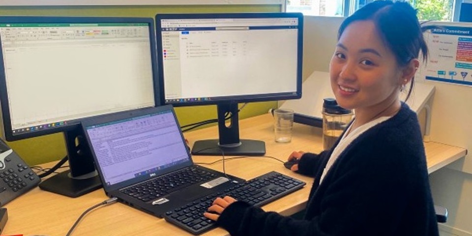 Linh Nyguen 2 Murdoch student sitting at desk