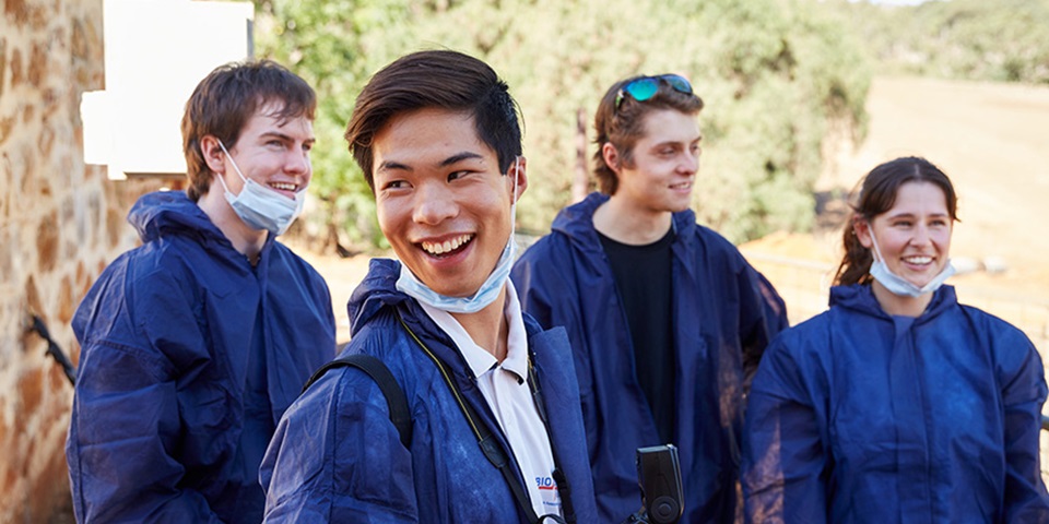 MMFS_Study_Feature Murdoch students in the field wearing protective gear.