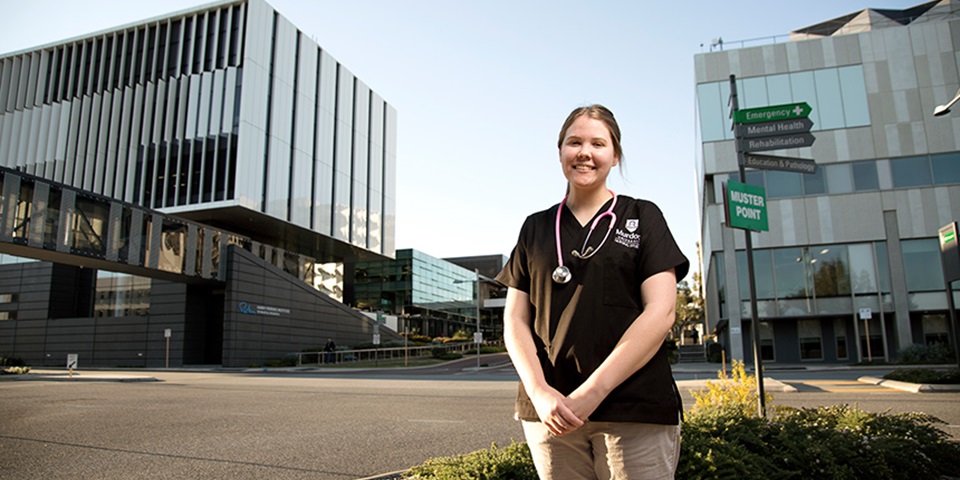 Murdoch Nursing Student - Feature Murdoch nursing student standing in the Murdoch health precinct
