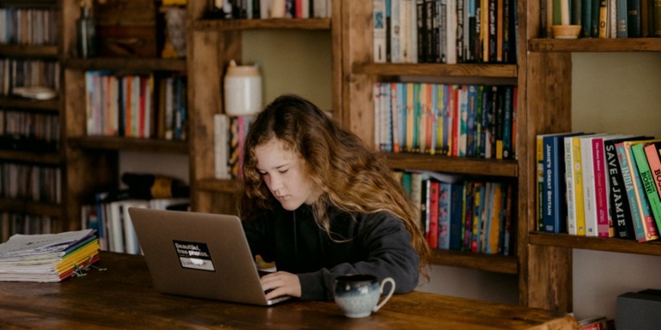 high school girl studying at table