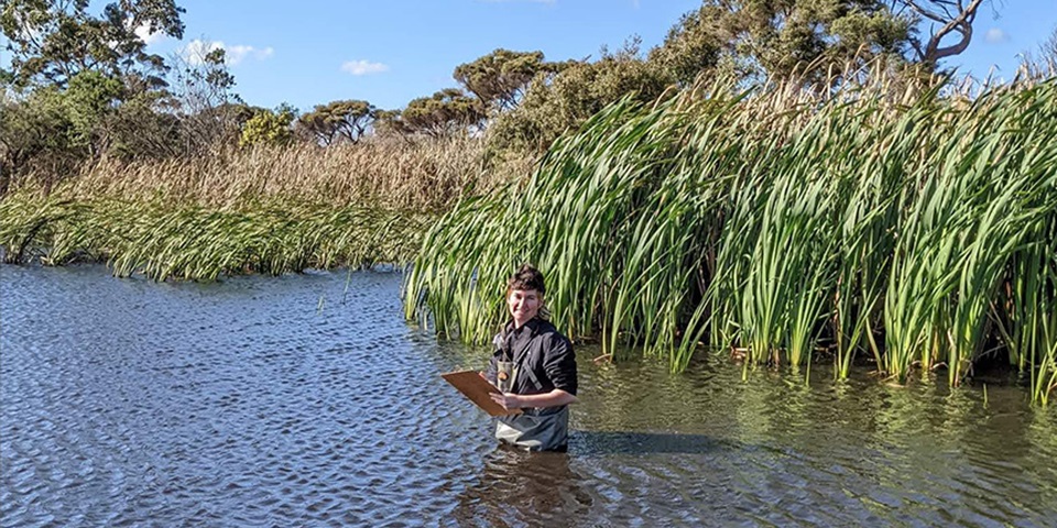 My Murdoch Journey Jemma Goss Jemma Goss standing in the middle of swamp water