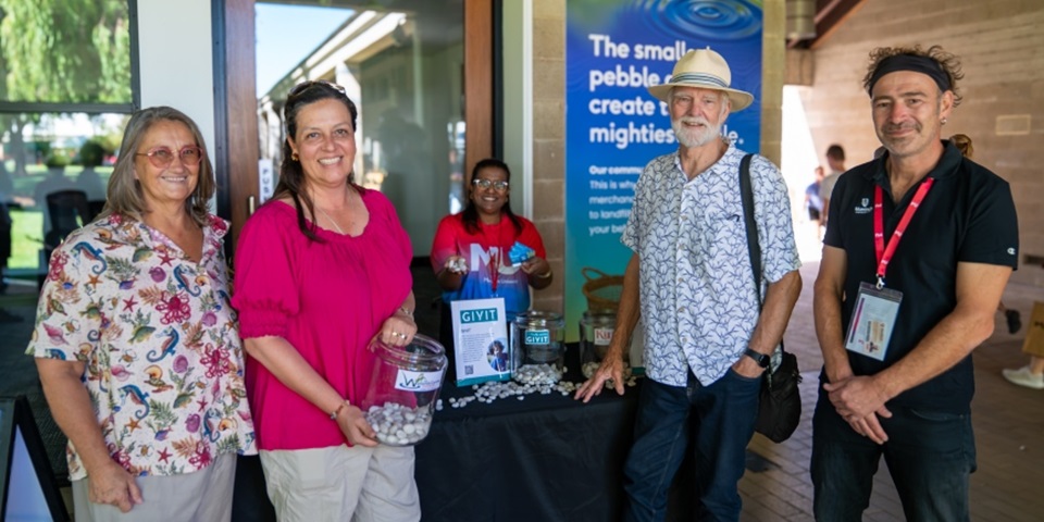 Jaki Richardson, Ana Terrazas and Paul Hansen from The Wetlands Centre with Dr Martin Breuckner at the Open Day Giving stand