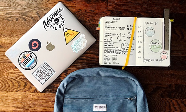 Overlay of books, backpack and laptop