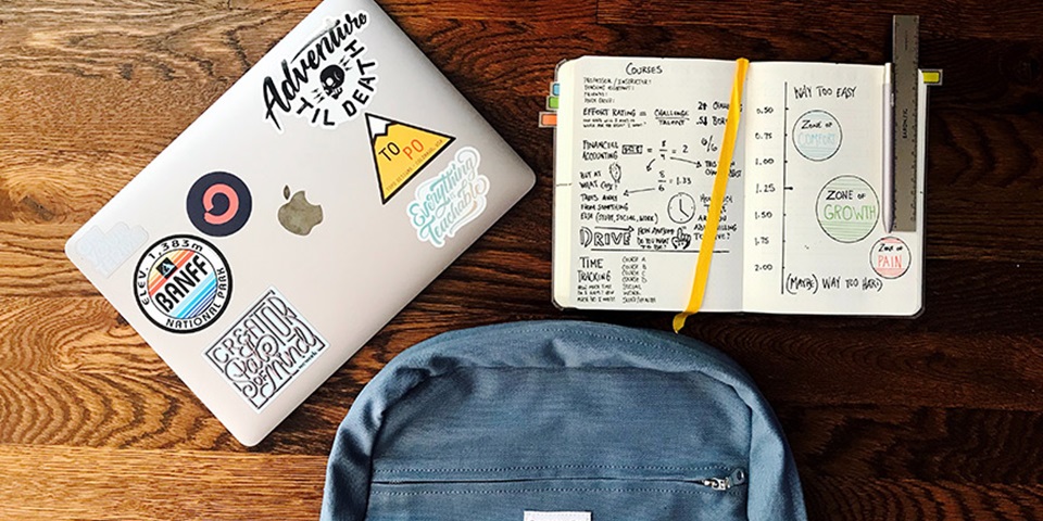 Overlay of books, backpack and laptop