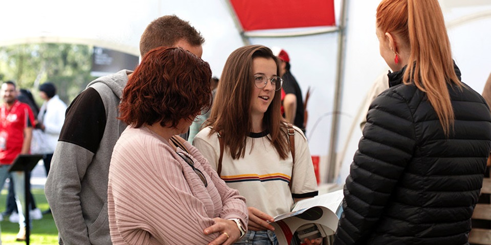 Parents with their child talking to an advisor at Murdoch
