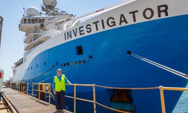 Professor Lynnath Beckley in front of the RV Investigator