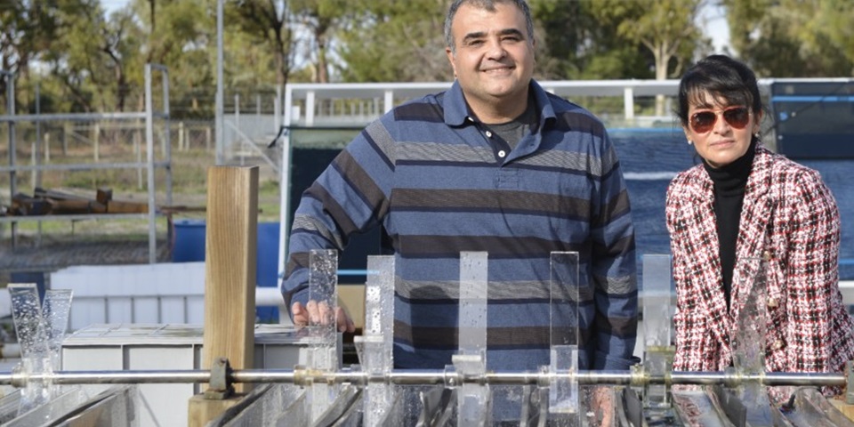 Parisa Bahri and Navid Moheimani beside water research vessels