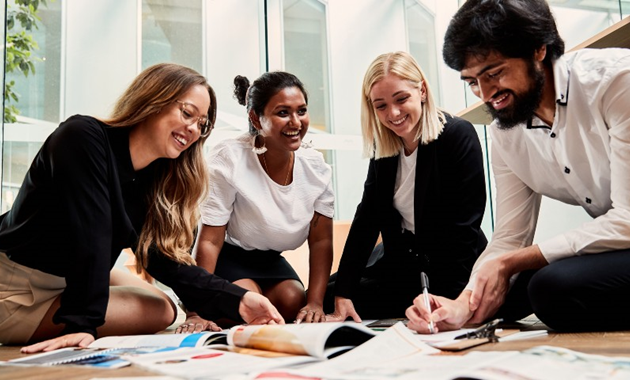 Students collaborating in a business setting