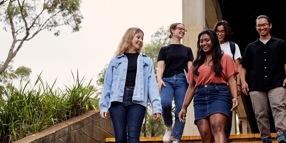 Students walking down outdoor stairs