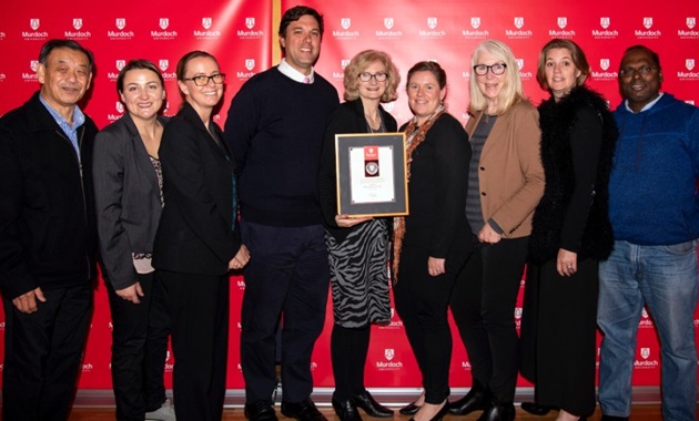 Meat science researchers standing together at the staff awards