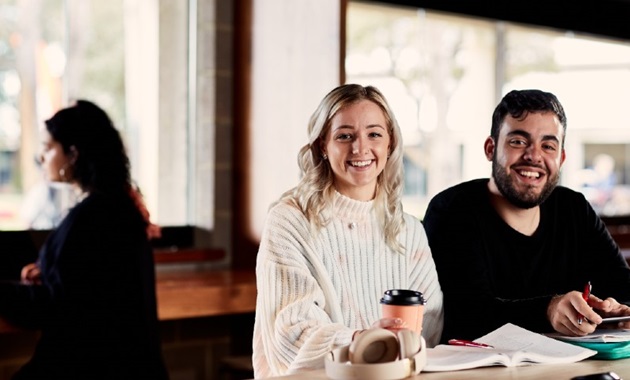 Two students in the Student Hub