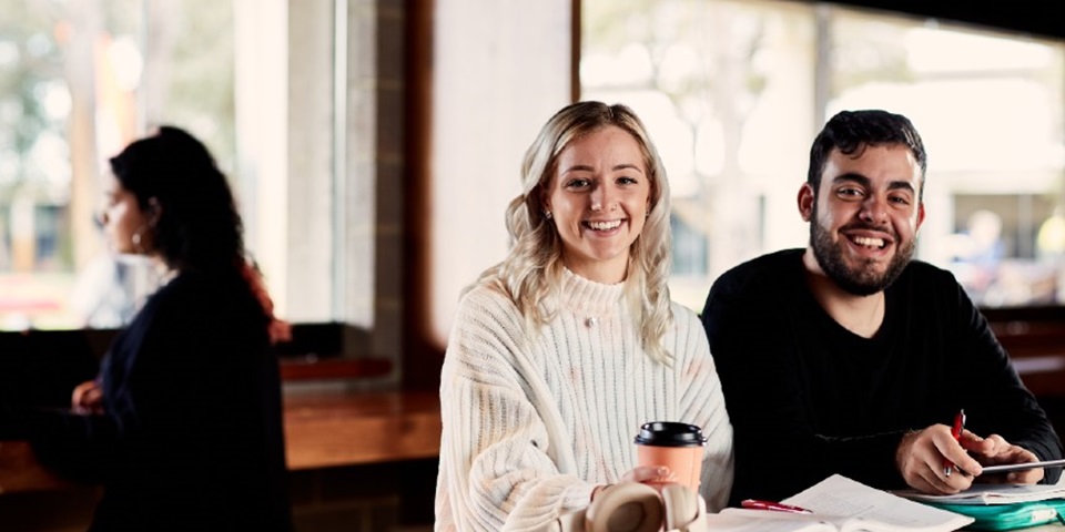 Two students in the Student Hub .