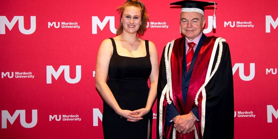 Student award winner Brianna Jane Hill, a white female with Vice Chancellor of Murdoch University Professor Andrew Deeks, a white male wearing full university regalia