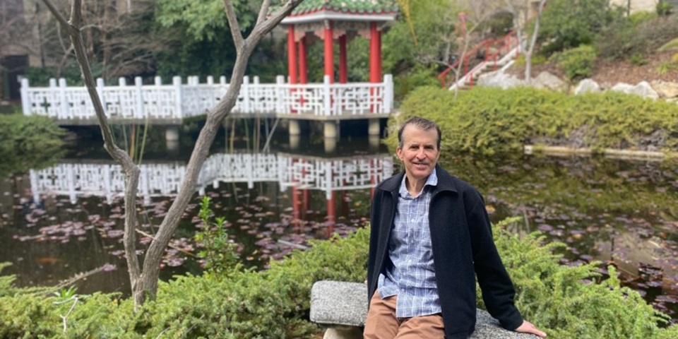 Warren Feature Warren sitting at the Chinese Gardens on Murdoch Campus