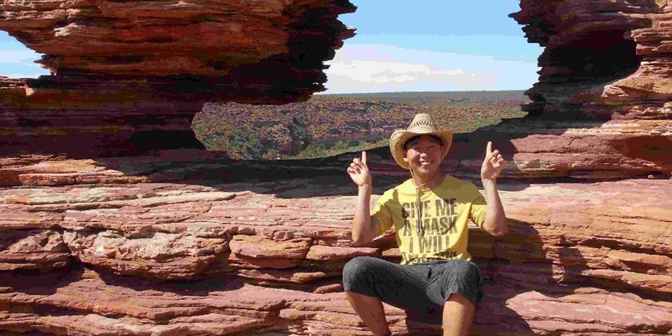 Yuki Iwasaki feature image Murdoch student Yuki Iwasaki sitting at the top of a gorge